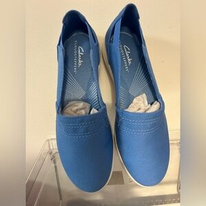 Brand new! Blue Clark’s cloud steppers 
Size 7